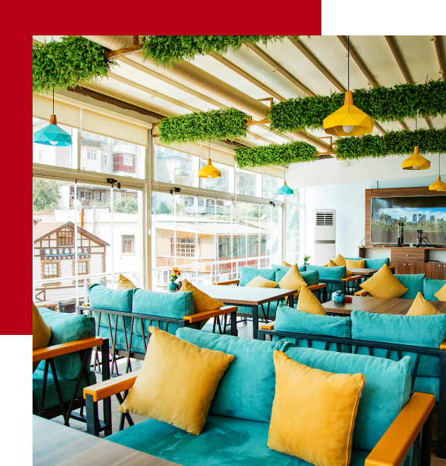 cafe-terrace-with-turquoise-sofas-yellow-pillows