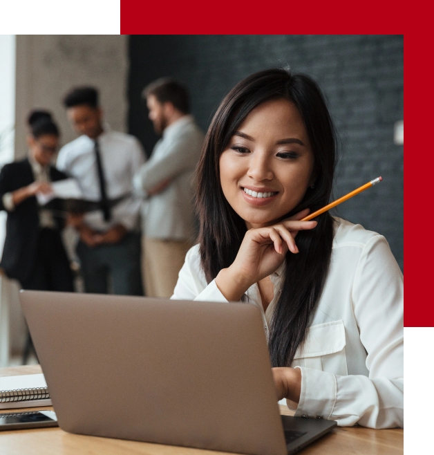 cheerful-young-asian-businesswoman-using-laptop